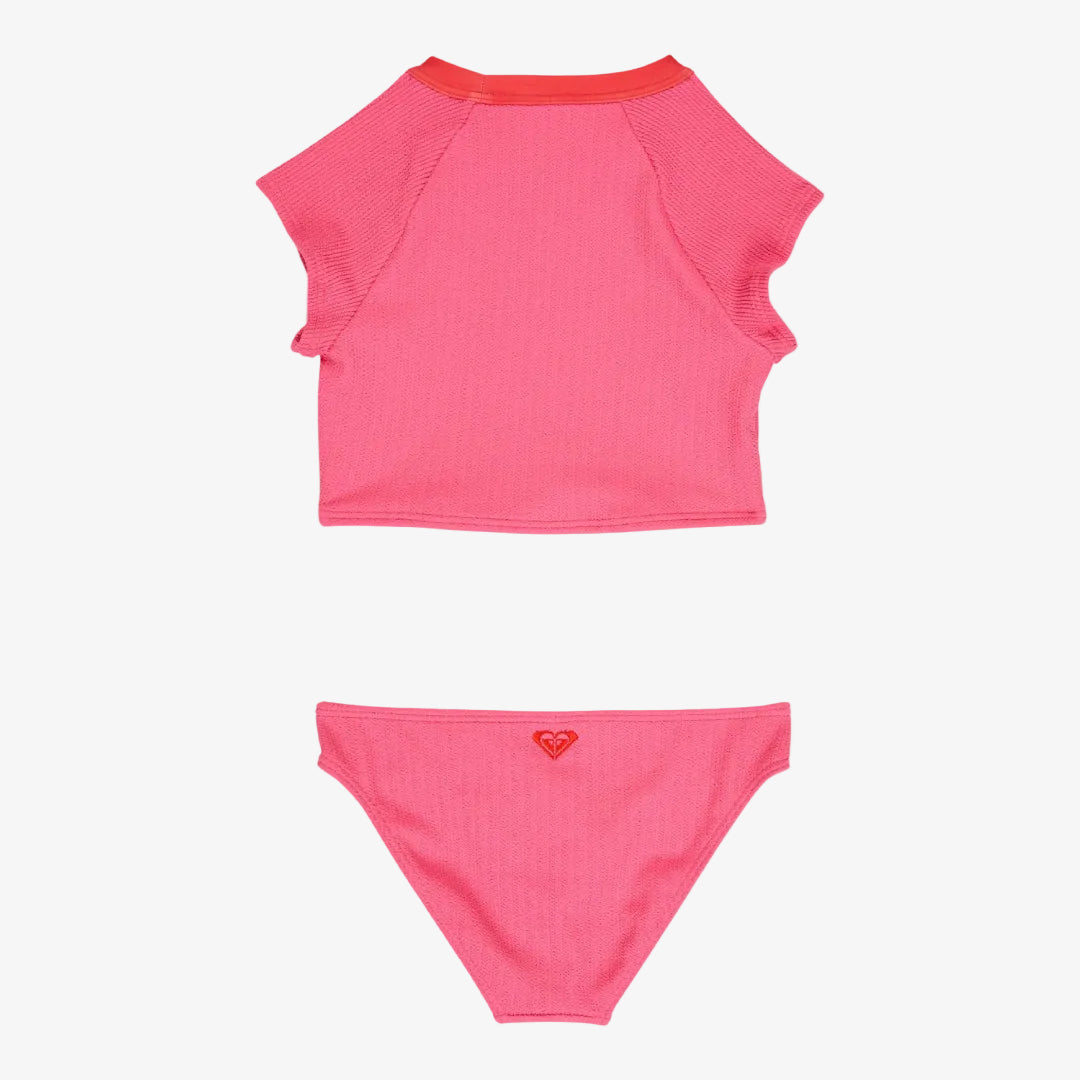 Pink bikini set with a small logo on a white background